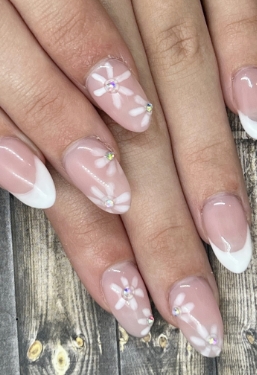 Picture of vibrant, multi-color painted nails on hand model